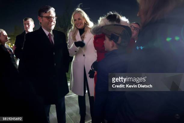 Speaker of the House Mike Johnson and his wife Kelly Johnson visit with guests during the lighting ceremony for the U.S. Capitol Christmas Tree on...