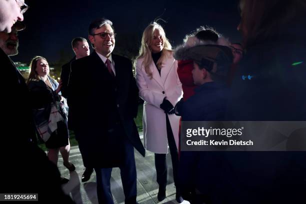 Speaker of the House Mike Johnson and his wife Kelly Johnson visit with guests during the lighting ceremony for the U.S. Capitol Christmas Tree on...