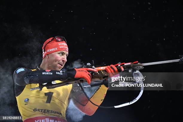 Philipp Nawrath of Germany competes at the shooting range in the men's 12,5 km pursuit event of the IBU Biathlon World Cup at the Östersund Ski...