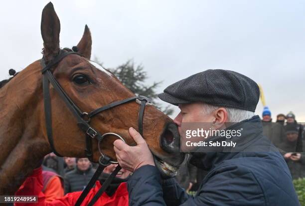 Meath , Ireland - 3 December 2023; Winning owner Brian Acheson kisses Teahupoo after victory in the Bar One Racing Hatton's Grace Hurdle during day...