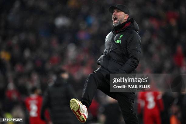 Liverpool's German manager Jurgen Klopp celebrates on the pitch after the English Premier League football match between Liverpool and Fulham at...