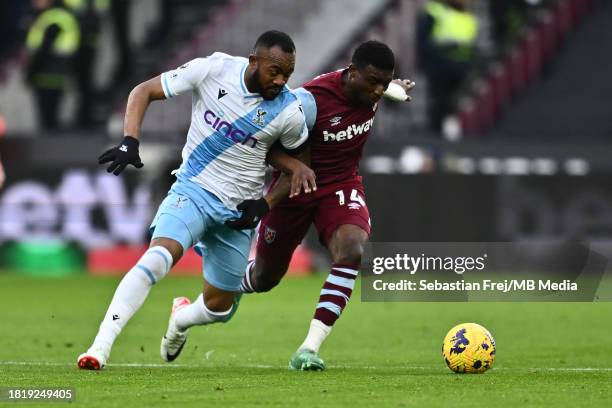 Jordan Ayew of Crystal Palace and Mohammed Kudus of West Ham United during the Premier League match between West Ham United and Crystal Palace at...