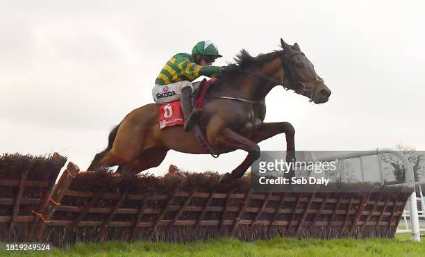 Meath , Ireland - 3 December 2023; Common Practice, with Mark Walsh up, jumps the last on their way to winning the Bar One Racing Handicap Hurdle...