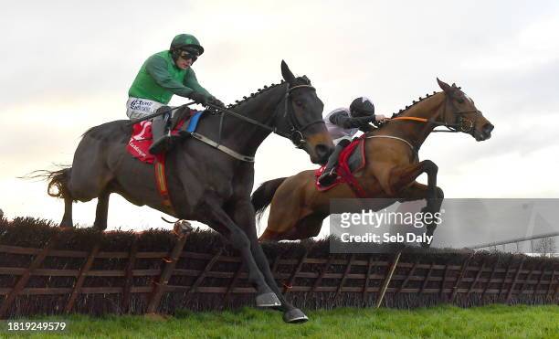 Meath , Ireland - 3 December 2023; Teahupoo, right, with Jack Kennedy up, jumps the last on their way to winning the Bar One Racing Hatton's Grace...