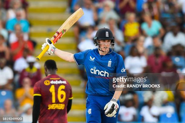 Harry Brook, of England, celebrates his half century during the first one day international cricket match between England and West Indies at Sir...
