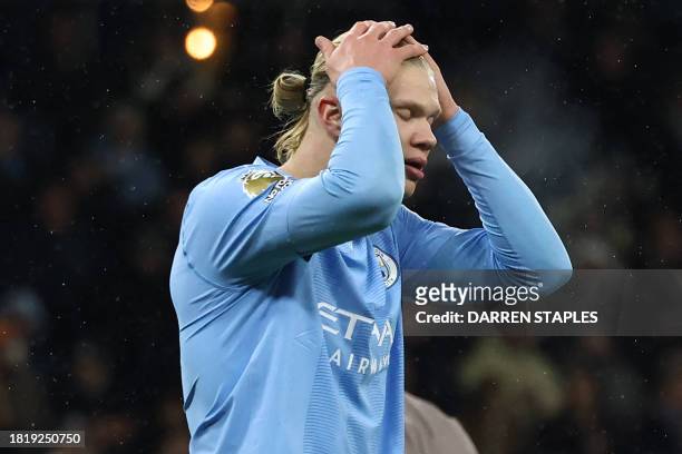 Manchester City's Norwegian striker Erling Haaland reacts after missing a chance during the English Premier League football match between Manchester...