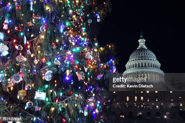 The U.S. Capitol Christmas Tree shines following the lighting ceremony on the West Front of the U.S. Capitol on November 28, 2023 in Washington, DC....