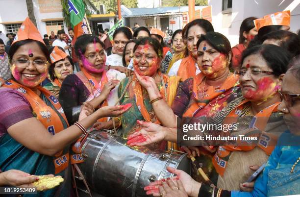 Workers and supporters celebrating the party's lead in Madhya Pradesh, Rajasthan and Chhattisgarh during counting of votes for the assembly...