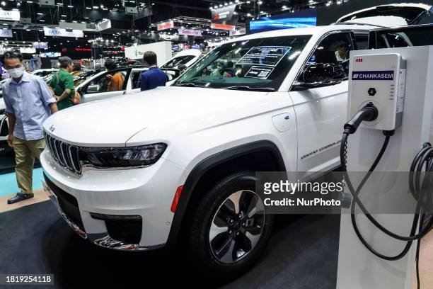 Visitors are looking at the JEEP Grand Cherokee 4xe at the 40th Thailand International Motor Expo 2023 in Bangkok, Thailand, on December 3, 2023. The...