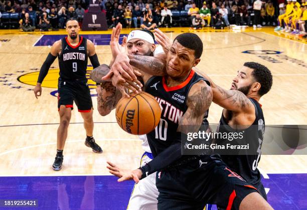 Los Angeles Lakers forward Anthony Davis battles Houston Rockets forward Jabari Smith Jr. For a rebound in the first half at Crypton.com Arena on...