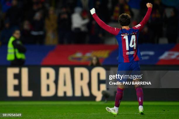 Barcelona's Portuguese forward Joao Felix celebrates scoring the opening goal during the Spanish league football match between FC Barcelona and Club...