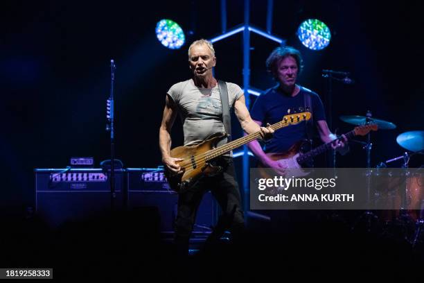 EEnglish singer Gordon Matthew Thomas Sumner, aka Sting, and Argentinian guitarist Dominic Miller perform at the Accor Arena in Paris on December 3,...