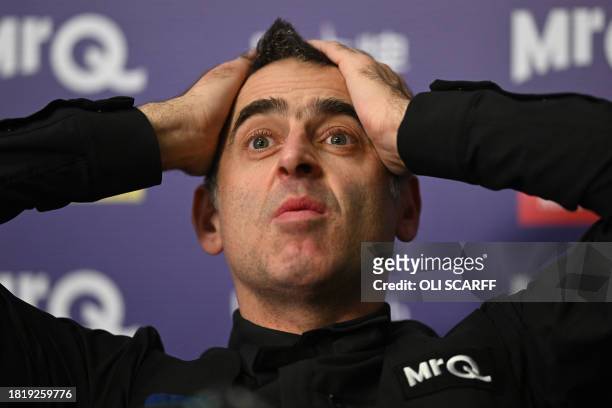 England's Ronnie O'Sullivan attends a press conference after his victory over China's Ding Junhui in the final of the 2023 MrQ UK Championship at the...