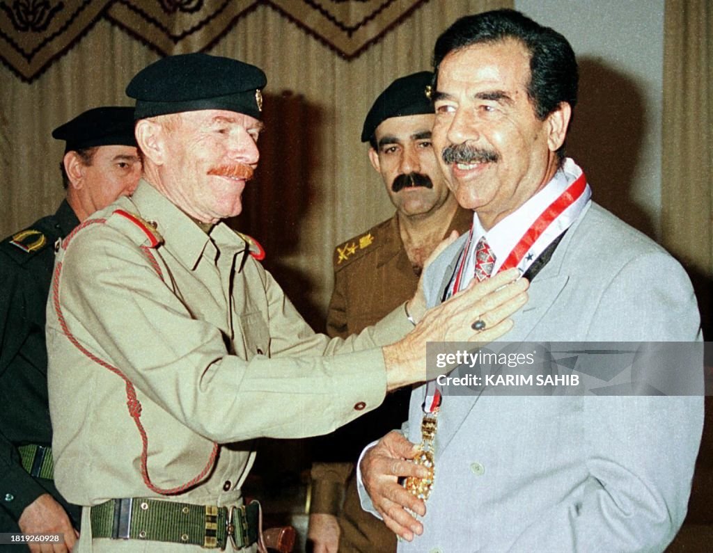 Sadam Rajkumar Iraqi President Saddam Hussein receives the medal of