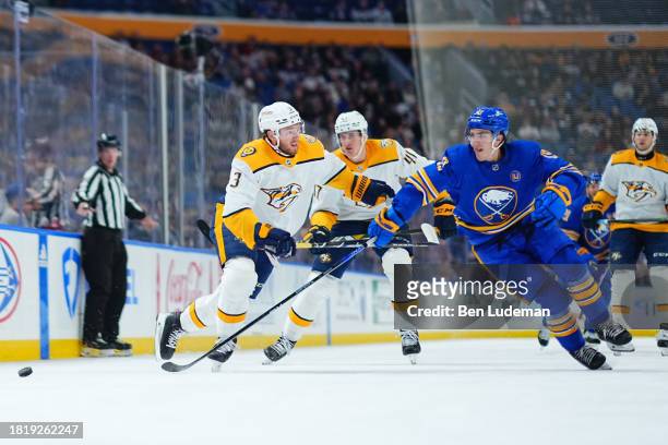 Peyton Krebs of the Buffalo Sabres skates against Jeremy Lauzon of the Nashville Predators during an NHL game on December 3, 2023 at KeyBank Center...