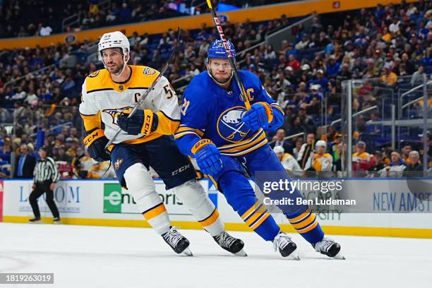 Kyle Okposo of the Buffalo Sabres skates against Roman Josi of the Nashville Predators during an NHL game on December 3, 2023 at KeyBank Center in...