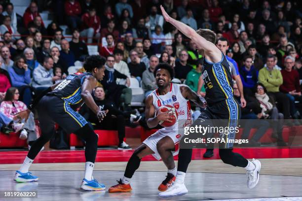 Vinnie Shahid of Pallacanestro Varese OpenJobMetis competes for the ball against Paul Eboua of Vanoli Basket Cremona and Wayne McCullough of Vanoli...