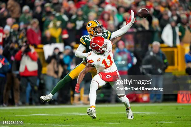 Cornerback Carrington Valentine of the Green Bay Packers deflects a pass intended for wide receiver Marquez Valdes-Scantling of the Kansas City...