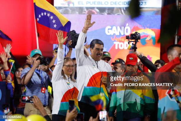 President of the Bolivarian Republic of Venezuela, Nicolás Maduro, greets supporters before giving a speech as the National Electoral Council issued...