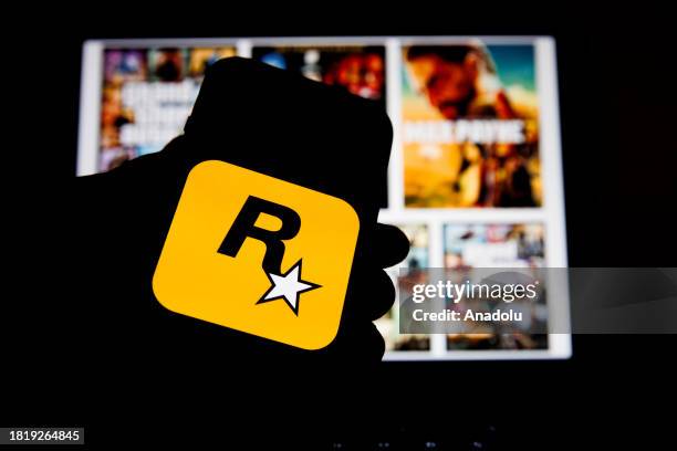 In this photo illustration, 'Rockstar Games' logo is displayed on a mobile phone screen in Ankara, Turkiye on December 03, 2023.