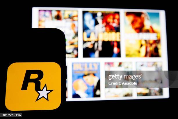 In this photo illustration, 'Rockstar Games' logo is displayed on a mobile phone screen in Ankara, Turkiye on December 03, 2023.