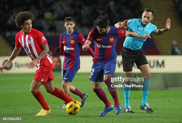 Ilkay Gundogan is colliding with the referee Jose Maria Sanchez Martinez during the match between FC Barcelona and Club Atletico de Madrid for week...