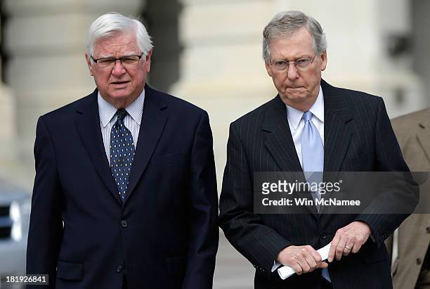 Senate Minority Leader Mitch McConnell walks with Rep. Harold Rogers to a press conference with House Republicans on proposed greenhouse gas...