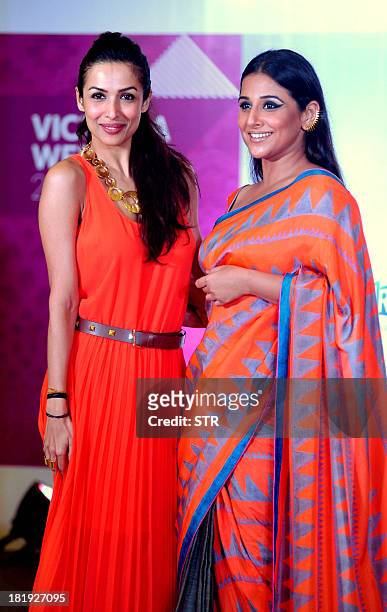Indian Bollywood film actress Malaika Arora Khan and Indian Brand Ambassador for the Indian Film Festival of Melbourne, Vidya Balan pose during the...