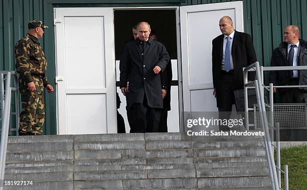 Russian President Vladimir Putin and Belarussian President Alexander Lukashenko watch joint Russian-Belarussian military exercises at the polygon on...