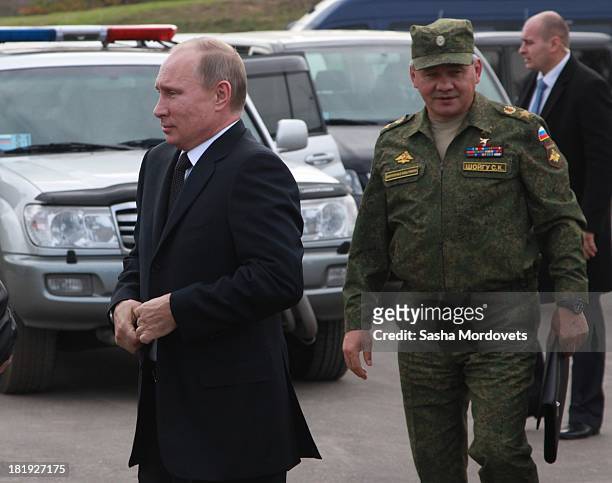 Russian President Vladimir Putin and Defence Minister Sergiei Shoigu seen during a joint Russian-Belarussian military exercises at the polygon on...