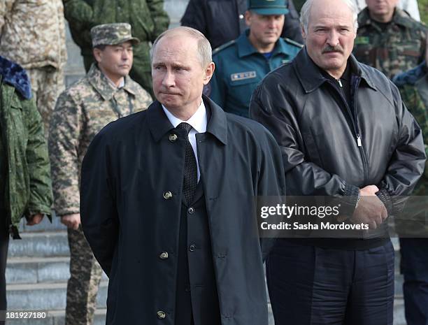 Russian President Vladimir Putin and Belarussian President Alexander Lukashenko watch joint Russian-Belarussian military exercises at the polygon on...