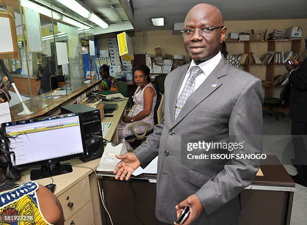 The General Director of Ivory Coast's mail services "La Poste," Mamadou Konate, stands in the offices in Abidjan on September 26, 2013. AFP PHOTO /...