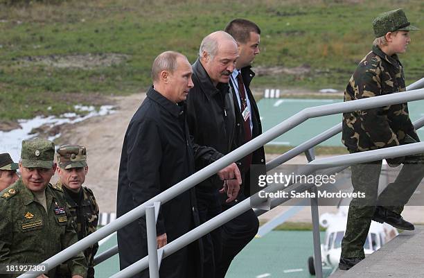 Russian President Vladimir Putin and Belarussian President Alexander Lukashenko attend a joint Russian-Belarussian military exercises at the polygon...