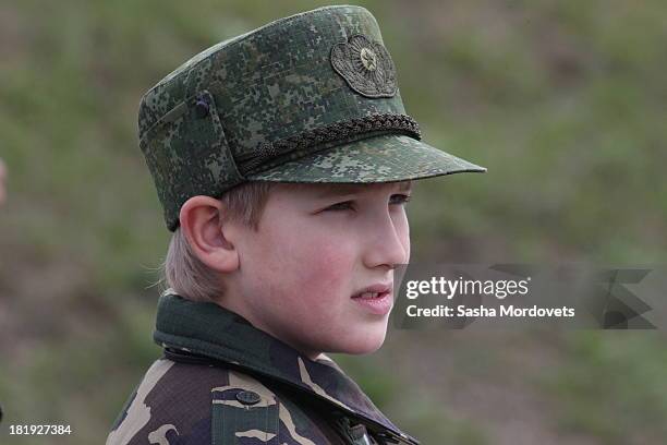 Belarussian President Alexander Lukashenko's son Nikolai watches a joint Russian-Belarussian military exercises at the polygon on September 26, 2013...