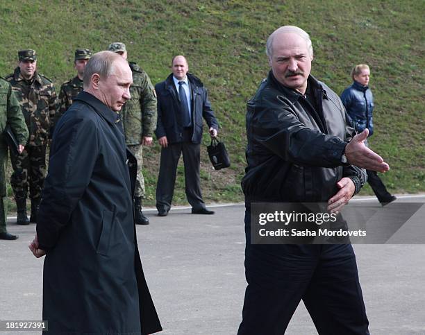 Russian President Vladimir Putin and Belarussian President Alexander Lukashenko attend a joint Russian-Belarussian military exercises at the polygon...