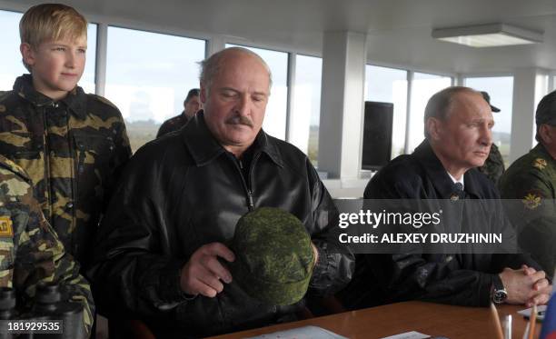 Russia's President Vladimir Putin and his Belarus counterpart Alexander Lukashenko watch a joint military exercises of Russian and Belarus troops at...