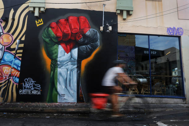 AUS: Artist Scott Marsh Creates Pro-Palestine Mural In Sydney