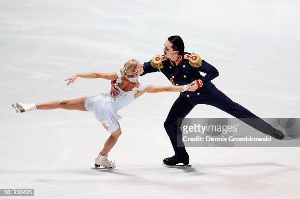 Tatiana Volosozhar and Maxim Trankov of Russia compete in the Pairs Short Program during day one of the ISU Nebelhorn Trophy at Eissportzentrum...
