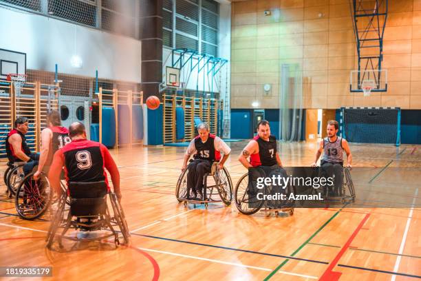 male wheelchair basketball players struggling for ball - basketball player close up stock pictures, royalty-free photos & images