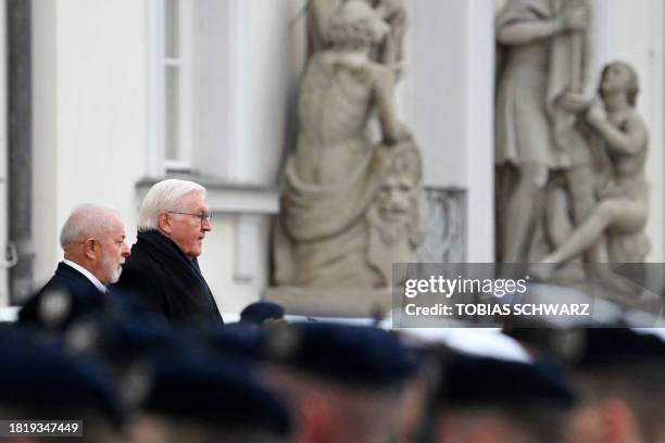 German President Frank-Walter Steinmeier and Brazilian President Luiz Inacio Lula da Silva watch soldiers of the German Bundeswehr's honour guard...