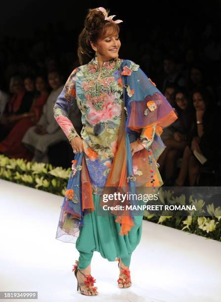 Indian actress and member of Parliament Jaya Prada displays a creation by Indian designers Ashima and Leena during the Wills India Fashion Week...