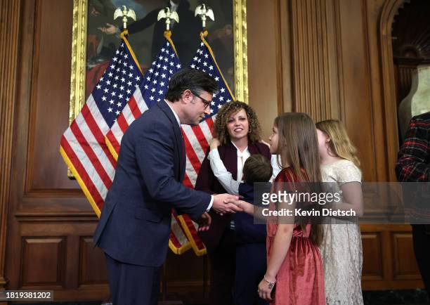 Speaker of the House Mike Johnson greets members of Rep. Celeste Maloy's family as they arrive for a photo-op for her ceremonial swearing-in at the...