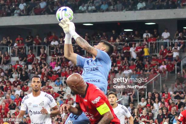 Joao Paulo from Santos is playing in the match against Athletico PR for the Brazilian League Serie A 2023 Round 37 at Couto Pereira Stadium in...