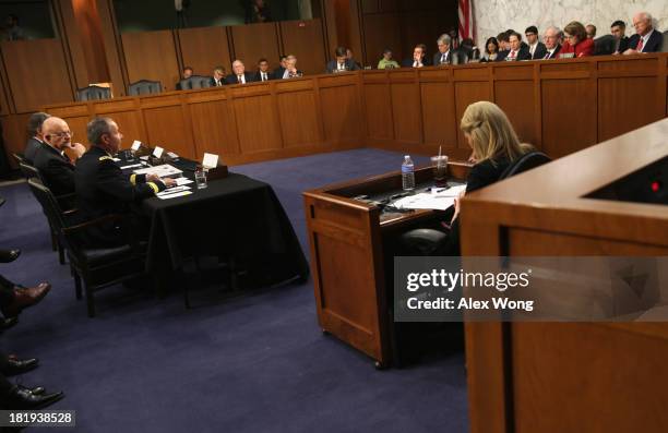 Director of National Intelligence James Clapper and National Security Agency Director General Keith Alexander testify during a hearing before the...