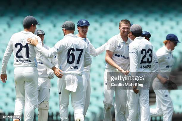 Jackson Bird of New South Wales celebrates with team mates after taking the wicket of Caleb Jewell of the Tigers during the Sheffield Shield match...