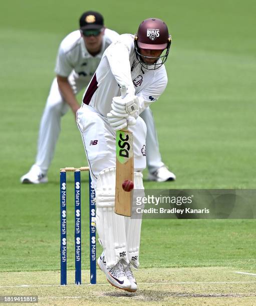 Usman Khawaja of Queensland plays a shot during day two of the Sheffield Shield match between Queensland and Western Australia at The Gabba, on...