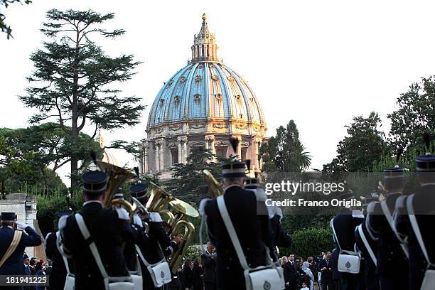 The Band of the Vatican Gendarmerie perform at the Giardino Quadrato surrounded by the Vatican Museums and the Vatican gardens during the celebration...