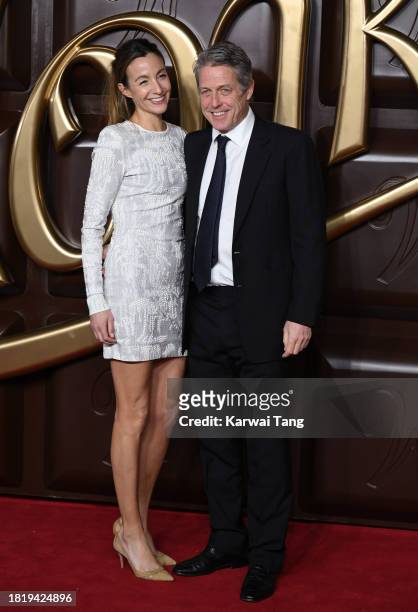 Anna Elisabet Eberstein and Hugh Grant arrive at the "Wonka" World Premiere at The Royal Festival Hall on November 28, 2023 in London, England.