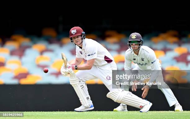 Jack Clayton of Queensland plays a shot during day two of the Sheffield Shield match between Queensland and Western Australia at The Gabba, on...