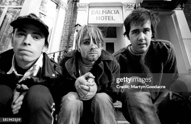 Group portrait of American grunge band Nirvana in Shepherd's Bush, London, October 1990. L-R Dave Grohl, Kurt Cobain and Krist Novoselic.